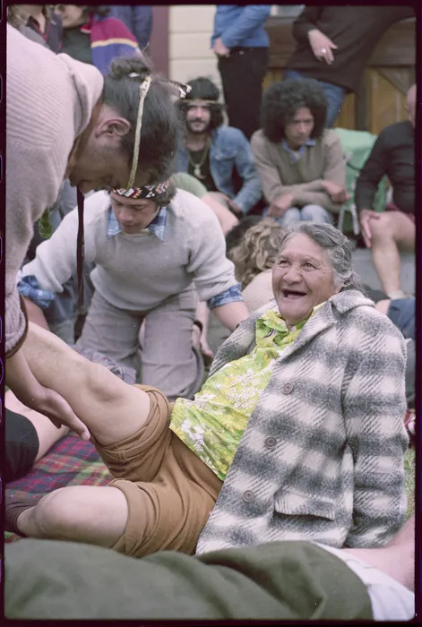 Marcher having her sore legs massaged, Poutu Marae, Shannon