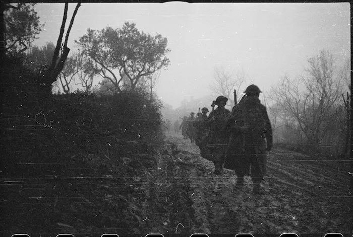 NZ Infantry formation moves forward through winter conditions in Italy, World War II - Photograph taken by George Kaye