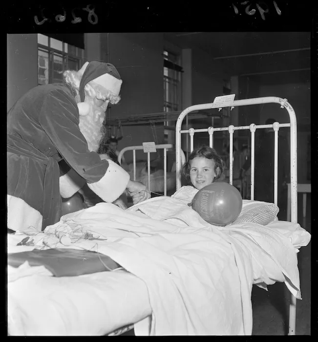 Children in hospital being visited by Santa Claus