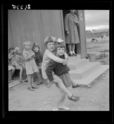 Image: Kindergarten children playing outside their dormitory at a Polish refugee camp, Pahiatua