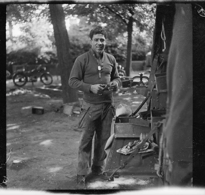 New Zealand soldier by truck, World War Two