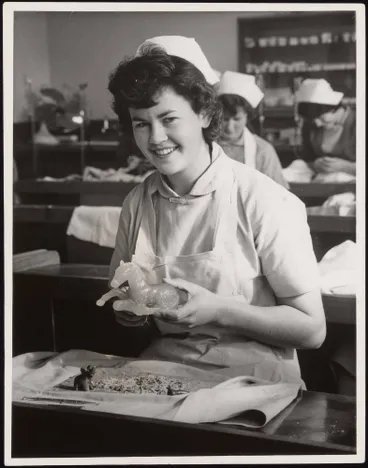 Image: Nurse Brindle carving a horse out of wax, dental school, Auckland