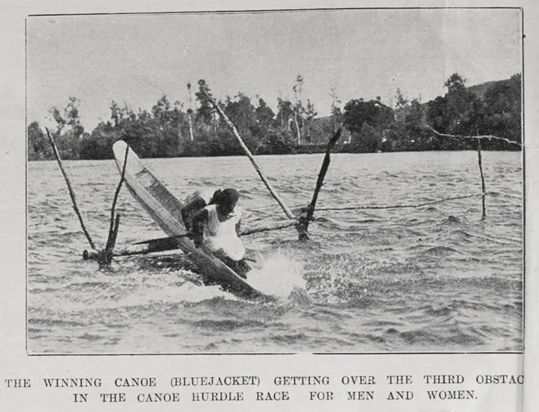 The winning canoe, Bluejacket, getting over the third obstacle in the canoe hurdle race for men and women