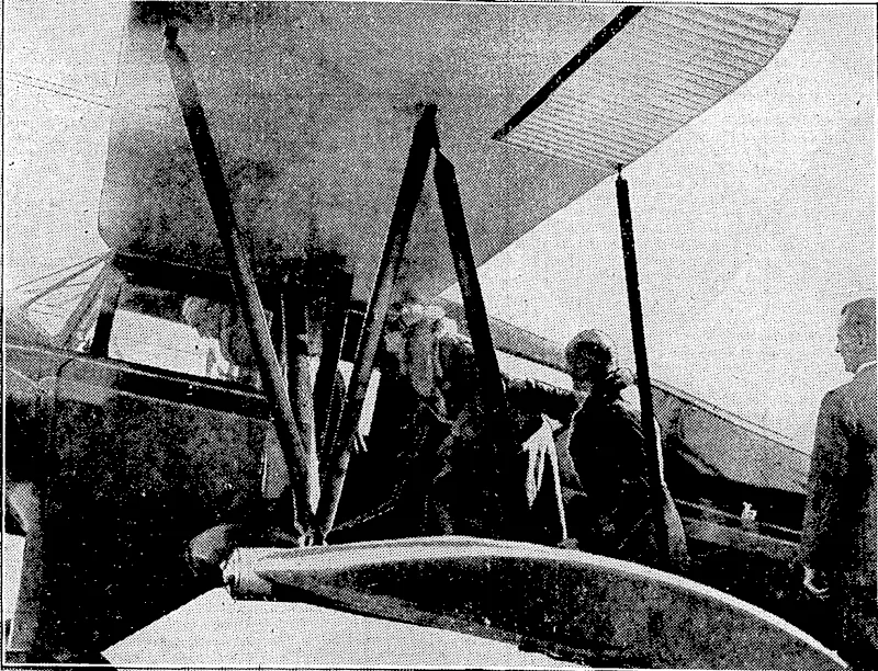 ETening Post", Photo. THEIR EXCELLENCIES TAKE AN AERIAL VIEW OF WELLINGTON.-M and Lady Bledisloe entering the Wellington Aero Club s Waco aeroplane yesterday afternoon for a flight over ■ the city. Lord Bledisloe is already inside and her Excellency is being assisted on board by Squadron-Leader G. L. Stedman. f (Evening Post, 25 July 1934)