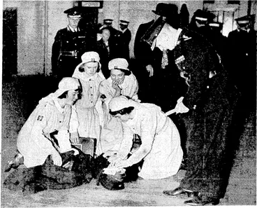 Image: Evening Post" Photo. Applying, first aid to an accident case, one of the competitions held at the annual Dominion and interdistrict competitions of the St. John Ambulance Brigade, held at the Drill Hall, Buckle Street, Wellington, on Saturday afternoon. (Evening Post, 05 September 1938)