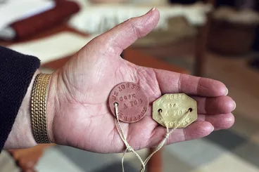 Image: Dog tags belonging to Jill Murphy, a nurse who worked in Vietnam during the Vietnam war - Photograph taken by Phil Reid