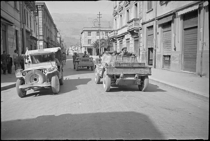 A New Zealand Dingo makes its way along a street in Sora, Italy, World War II - Photograph taken by George Kaye