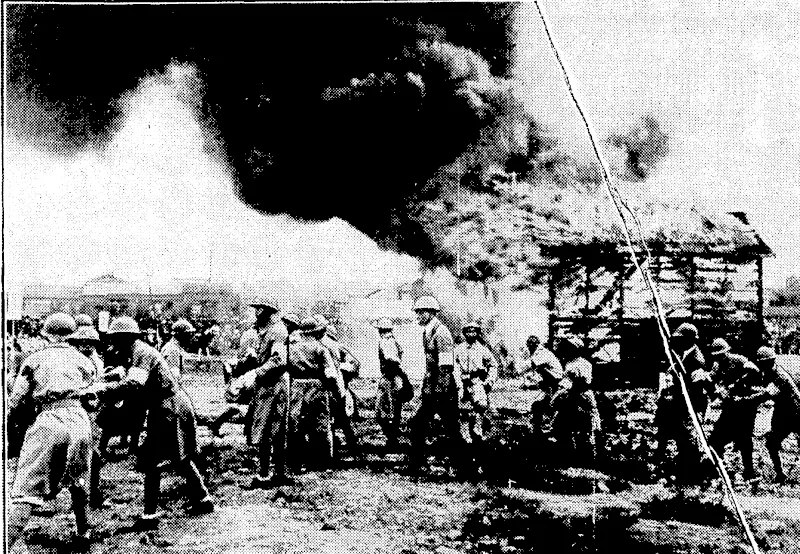 Boon *pn <ipnr>rui' l-Vnick TRAINING IN PREPARATION FOR AIRCRAFT ATTACKS.—Japan's first anti-aircraft training took place on July 4 at Asakusa, Tokiq, when men of the Reservists' Association and the Young Men s Asso^ ciation took part. "Rescue ivork" is in progress from a house destroyed by bombs during are air\ attack. 1 (Evening Post, 26 August 1933)