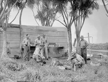 Image: [Servicemen around a campfire]