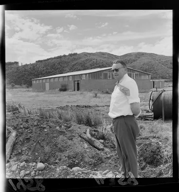 Image: Unidentified man standing outside the Taita Rugby Union Football Club gymnasium, Lower Hutt