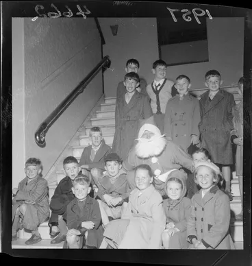Image: Children sitting with Santa Claus