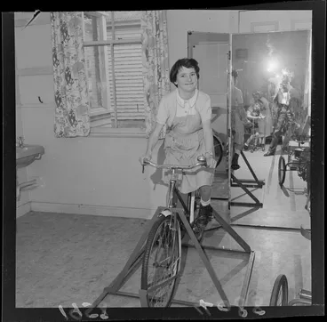 Image: A student riding a stationary bike at Kimi Ora School for children with special needs, Thorndon, Wellington