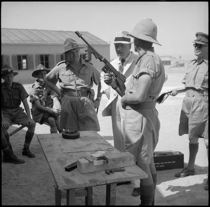 Prime Minister Peter Fraser shown light machine gun, Maadi