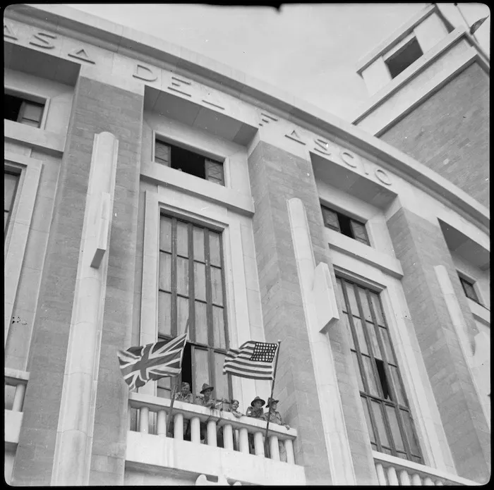 New Zealanders with POW Sub Commission on the balcony of the Fascist HQ in Taranto, Italy - Photograph taken by W A Brodie