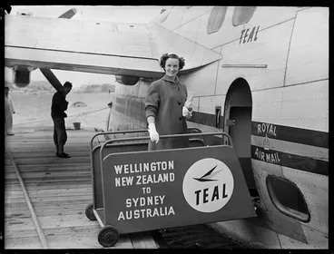 Image: Air hostess Miss J Stanich by the TEAL Solent flying boat Awatere, Evans Bay, Wellington