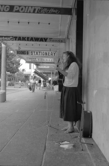 Image: A woman busking in Garden Place