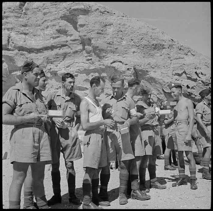 Personnel having tea break after setting up mobile surgical unit's tents, Egypt