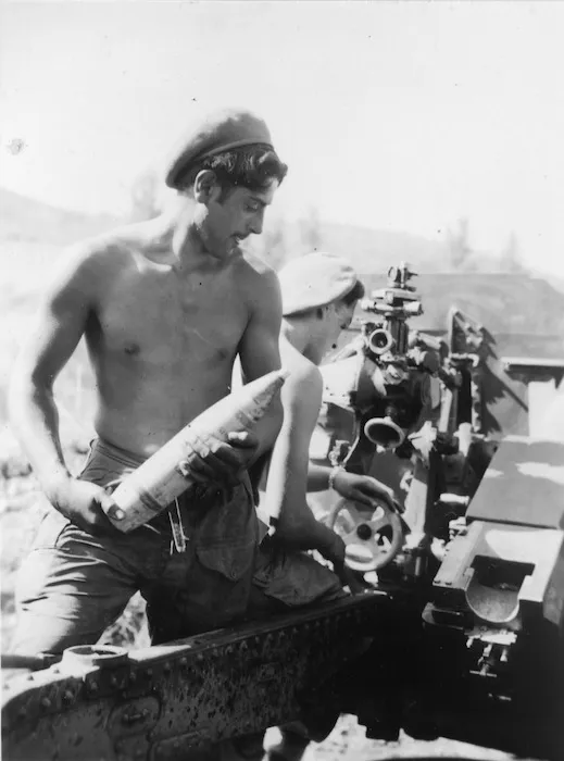 [Gunner G Horsefall standing by to reload a 25 pounder, Korea]