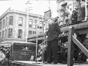 Image: Celebrations. Crowd at WWII, Victory over Europe ( VE ) Day Celebration. Held 9 May 1945, Man Making Speech from the Back of a Truck. Colombo Street by the United Service Hotel, at the High Street Corner. Christchurch, Canterbury, New Zealand.