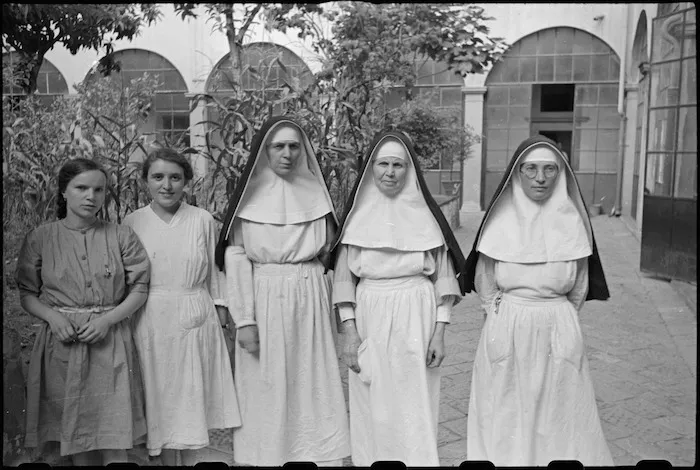 Sisters of San Felice Convent and civilian Red Cross workers caring for World War II German sniper victims in Florence, Italy - Photograph taken by George Kaye