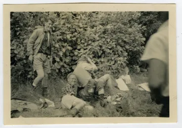 Image: "Graham Miller demonstrates how to start a brawl," The 1950 Tramp back to the Orongorongo Valley, Presbyterian Harrier Club - Wellington
