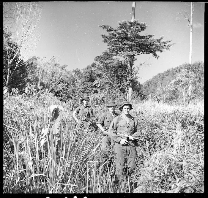 Private D Anstice, of the New Zealand Regiment in Malaya, leading soldiers into base in the Malayan rain forest