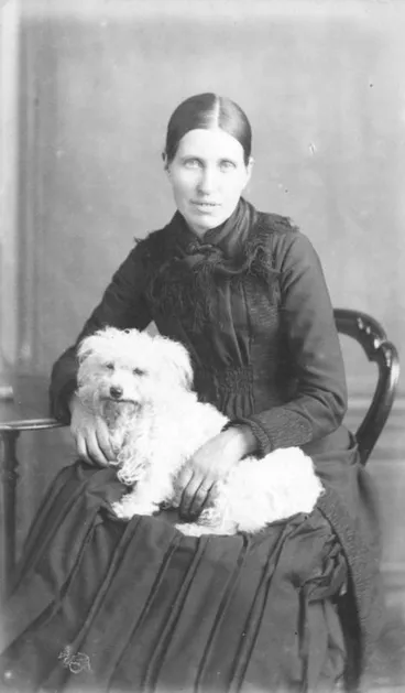 Image: Portrait of an unidentified woman with a dog