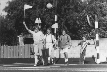 Image: Silverstream School pupils with red pedestrian flags, crossing Fergusson Drive near the Home of Compassion.