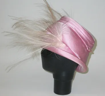 Image: Pink cloche hat with osprey feather trim