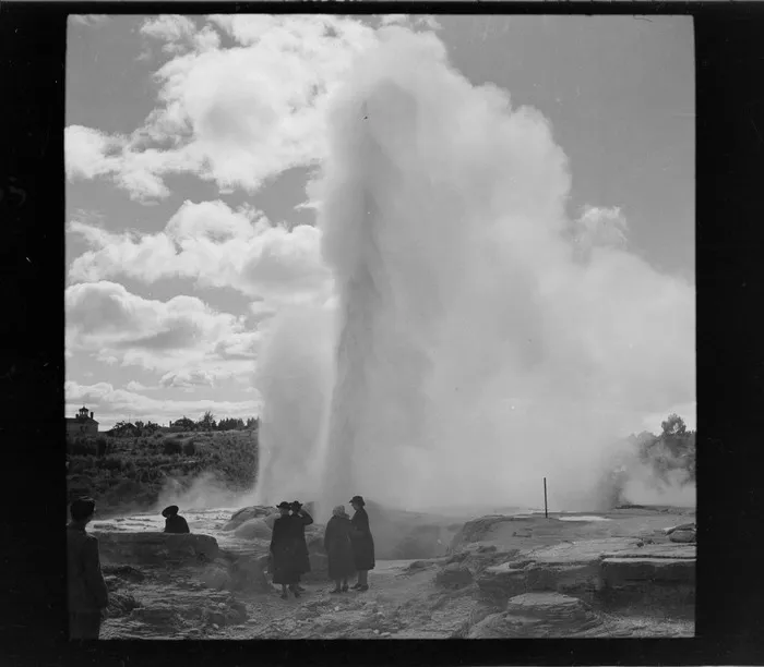 Pohutu Geyser, Rotorua, includes unidentified tourists and thermal area