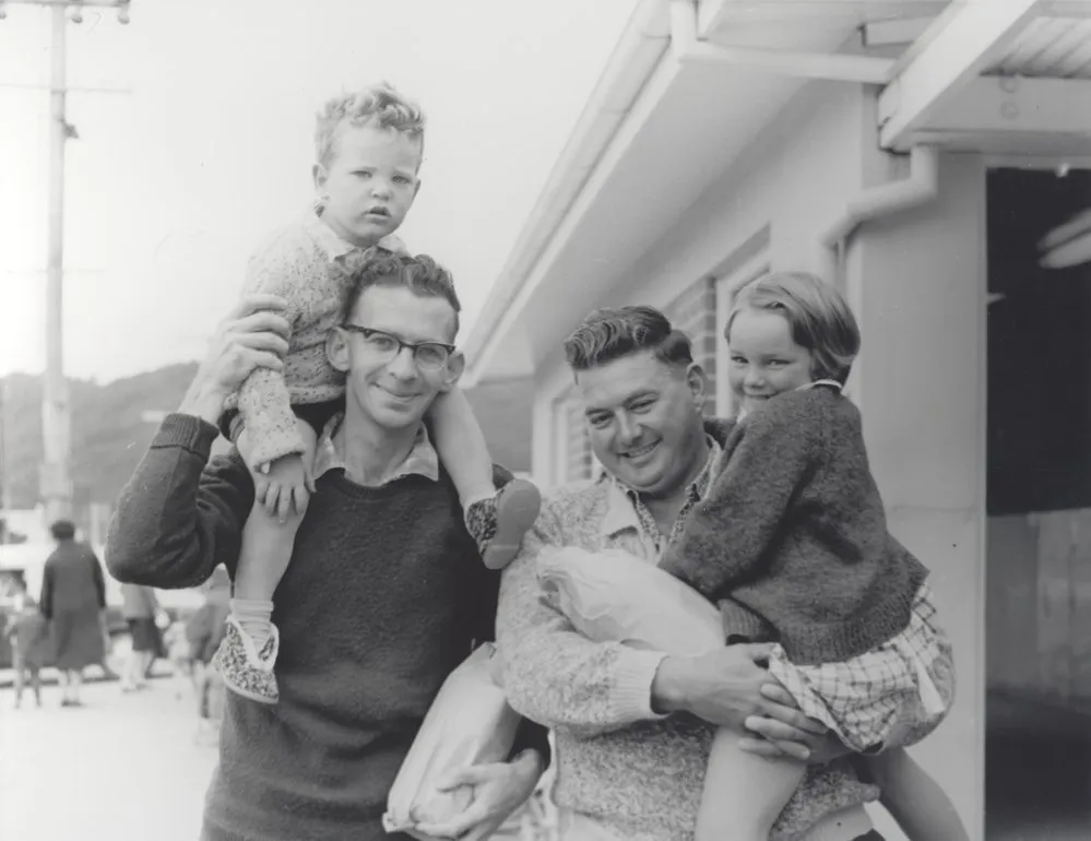 Fathers and their children outside Quinn's Post, 1960s