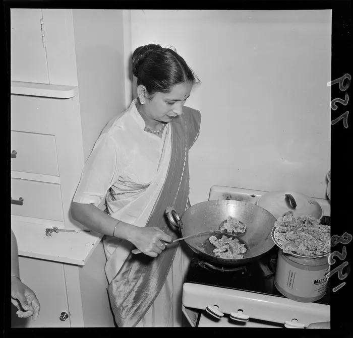 Unidentified woman preparing Indian food