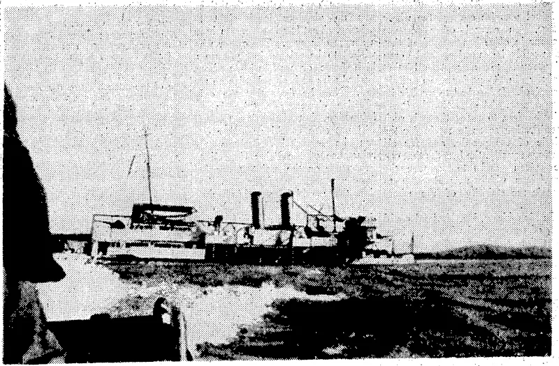 Staconto" • Photo. TheV.S.A. gunboat Panay, with flags fore and aft, as well as two large flags: placed' horizontally above, her superstructure, and .plainly visible, sinking in the Yangtze-kiang, about twenty-five miles above: :. Nanking after being bombed tby Japanese war planes. , This picture {was taken from the sternof the last • ■ ■ ■ . launch to leave the Panay. . ' ■ . ■ ■' ■ . (Evening Post, 25 January 1938)