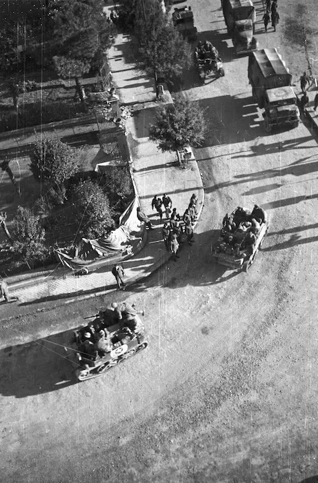 Kaye, George, 1914- : Bren carriers of the NZ Maori Battalion and transport moving through the Italian town of Forli on the way to the line