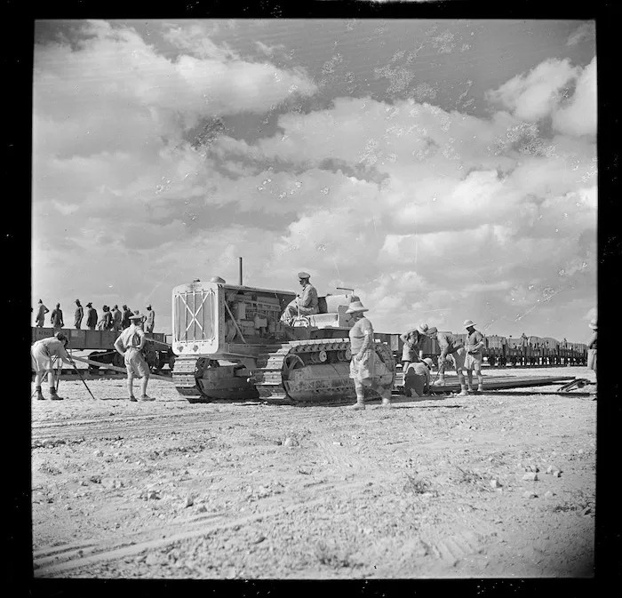Tractor, and soldiers, of the 2nd NZEF Railway Construction Company, advance from Egypt to Libya