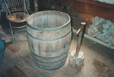 Image: Dolly tub and dolly tub plunger at Howick Historical Village used for washing clothes.