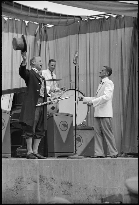 Ted Quill sings and Terry Vaughan conducts during a Kiwi Concert Party performance, Italy, World War II - Photograph taken by George Kaye
