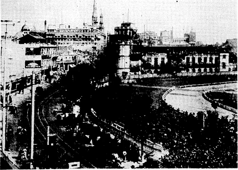 Bubbling; Well Road^ihe principal thoroughfare .through the .International. Settlement at Shanghai, and.the scene of much of ther present trouble between China and Japan.■,,■ Apportion of the racecourse in • the International Recreation Ground is seen on the right. (Evening Post, 21 August 1937)
