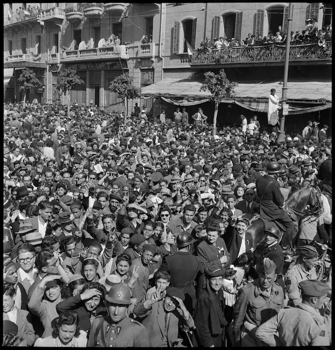 Crowded street scene in Tunis celebrating defeat of Axis troops - Photograph taken by M D Elias