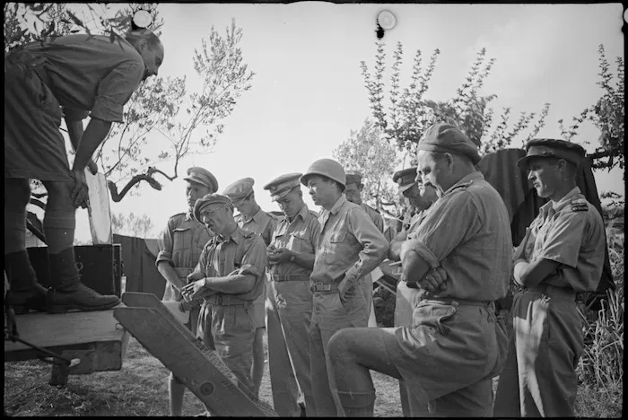 War correspondents updated by Captain Geoffrey Cox as New Zealand Division nears Florence, Italy, in World War II - Photograph taken by George Kaye