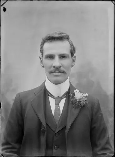 Image: Studio upper torso wedding portrait of unidentified groom with moustache and imperial shirt collar, polka dot tie and buttonhole, Christchurch