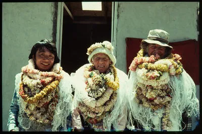 [Heavily garlanded Sir Edmund Hillary, Rex Hillary, and Japanese volunteer, Nepal]