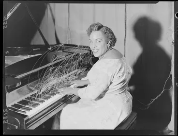 Image: Composite exposure depicting Winifred Atwell playing a piano