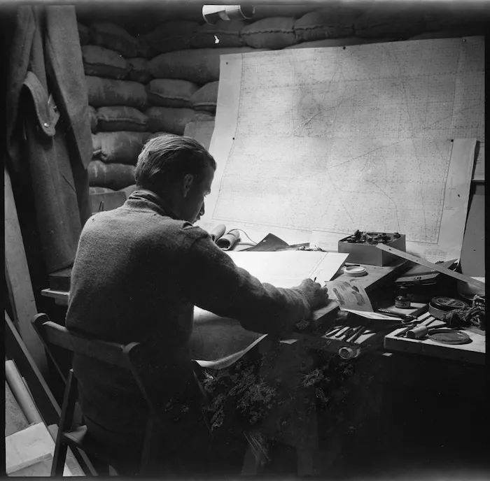 NZ draughtsman at work underground in the Western Desert