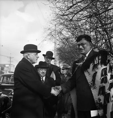 Image: Prime Minister Peter Fraser being welcomed to the opening ceremony of the Maori Community Centre in Auckland by Tapihana Paraire Paikea the Member of Parliament for Northern Maori