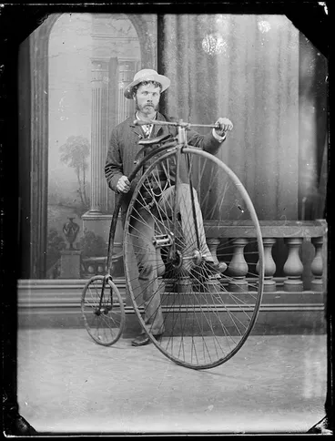 Image: Man with a penny farthing bicycle