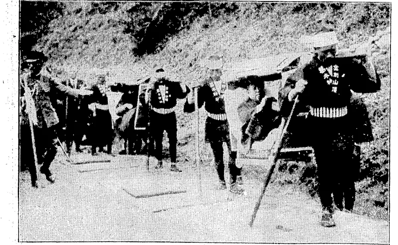 Sport and General, I'lioto. | Prince and Princess Kuni ascending Mount Kongo, a well-known Japanese poak, in the native carrier known as a '■-•..•■'•■• ■■ , . ■ , , . "Kaflo." (Evening Post, 16 June 1928)