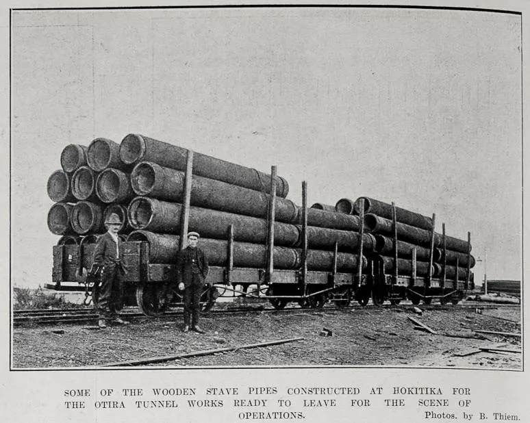 SOME OF THE WOODEN STAVE PIPES CONSTRUCTED AT HOKITIKA FOR THE OTIRA TUNNEL WORKS READY TO LEAVE FOR THE SCENE OF OPERATIONS