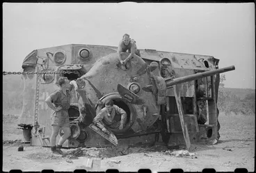 Image: New Zealanders working on a recaptured tank, World War II, Italy - Photograph taken by George Kaye