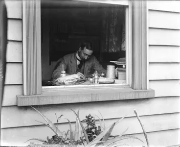 Man working at his desk, Arney Road, Remuera, 1907 Image: Man working at his desk, Arney Road, Remuera, 1907